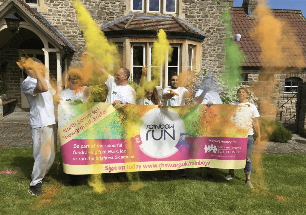 Sponsors-throwing-paint-with-banner-at-Charlton Farm