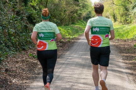 Two runners in CHSW running vests