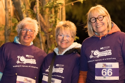Three smiling women at Moonlight Memory Walk Clevedon