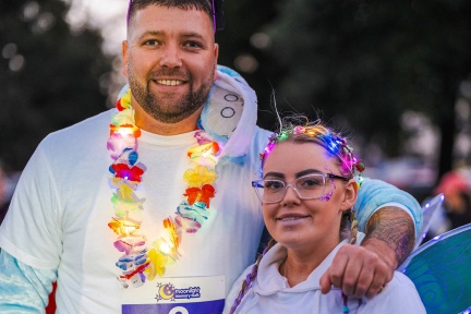 Man and woman with light up accessories at Moonlight Memory Walk