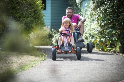 girl and dad on go-kart