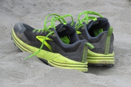 A pair of trainers in the sand