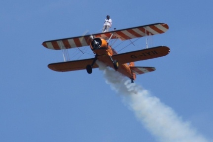 Wingwalker flying on a biplane