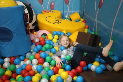 Girl playing in ball pit
