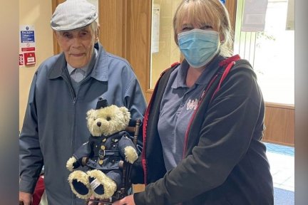 Jim Squires hands over his teddy bear to Michelle North, Senior Care Administrator at Little Bridge House