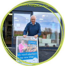 Volunteer outside the Cranbrook shop