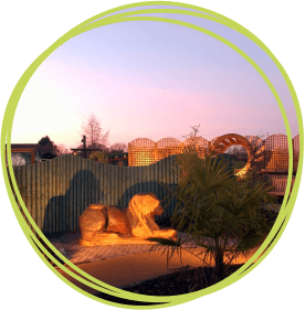 The lion at night in the Narnia sensory garden at Little Bridge House