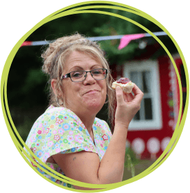 The Big South West Cream Tea Nurse eating a scone