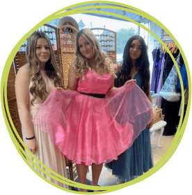 Honiton Community College students Ella-Mae Salter, Lian Galloen and Tia Rush try on some of the dresses
