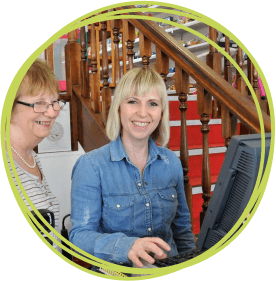 Volunteers working on the till 