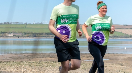 Man and woman running on the beach