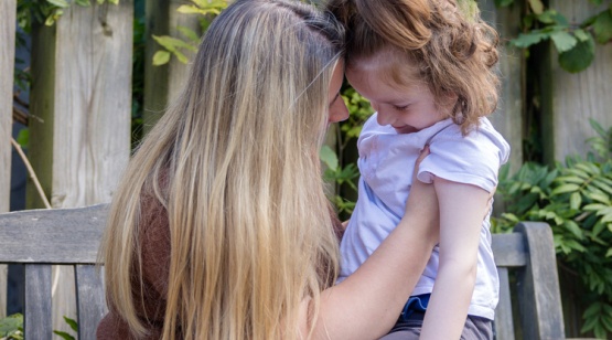 mum and girl smiling in the Little Harbour gardens