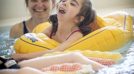 Girl with carer in the hydrotherapy pool