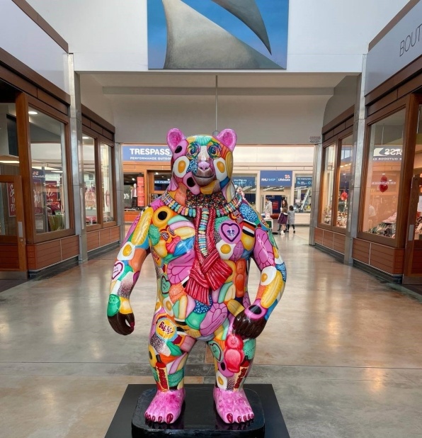 multi-coloured sculpted bear in centre frame