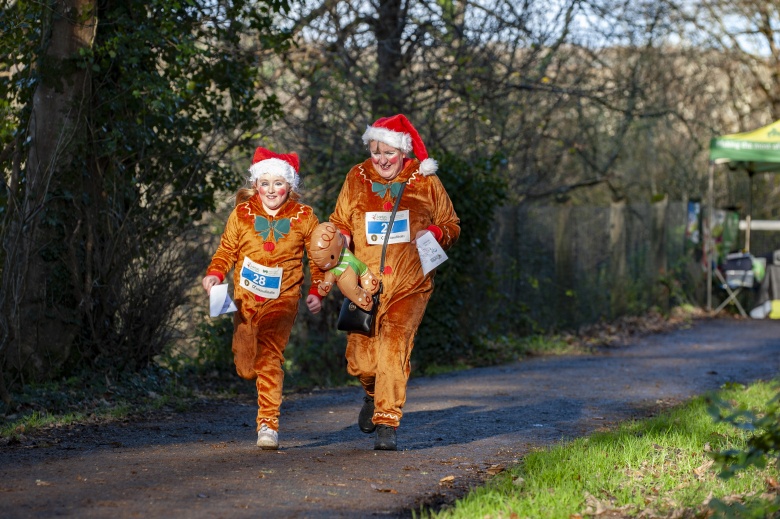 Two people dressed as reindeers in the santas run