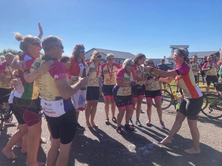 Birds on Bikes celebrating at the finish line