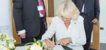 Her Majesty the Queen (formerly HRH The Duchess of Cornwall) signing guest book thumbnail