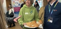 Fundraiser handing out a tray of croissants at the Business Breakfast thumbnail