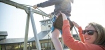 boy on swing with sibling team thumbnail