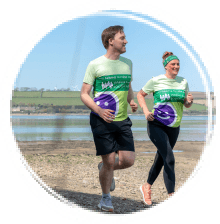 Man and woman running on the beach