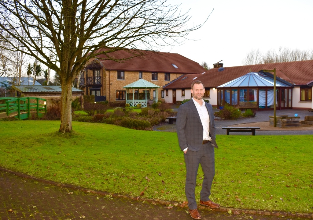 Phil Morris stood outside Little Bridge House children's hospice 