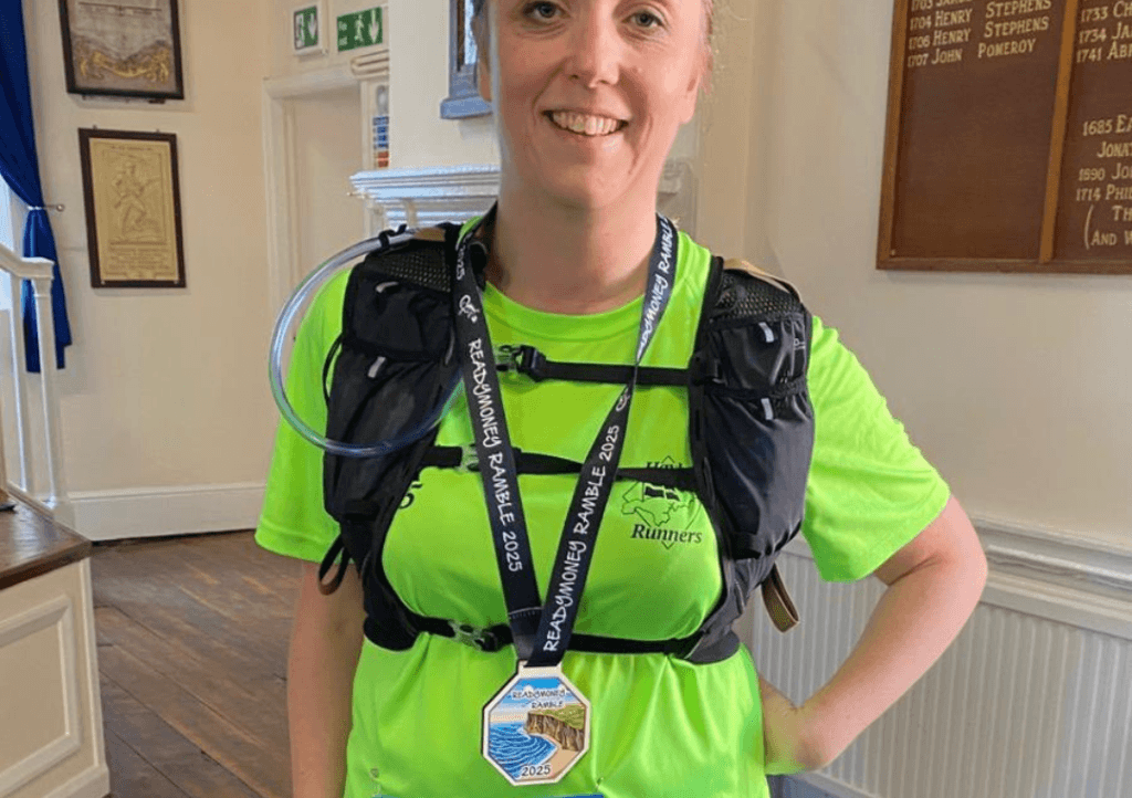 Hannah with a running medal