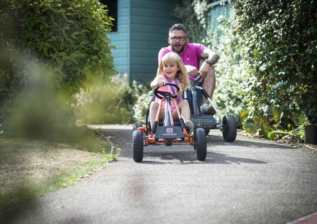 girl and dad on go-kart