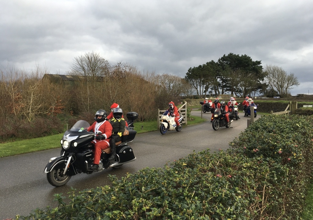 Santas on a Bike arriving at Little Harbour