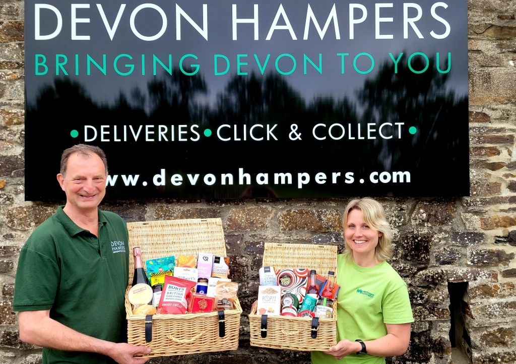 Adam from Devon Hampers with Zoe from CHSW celebrating the launch of their partnership