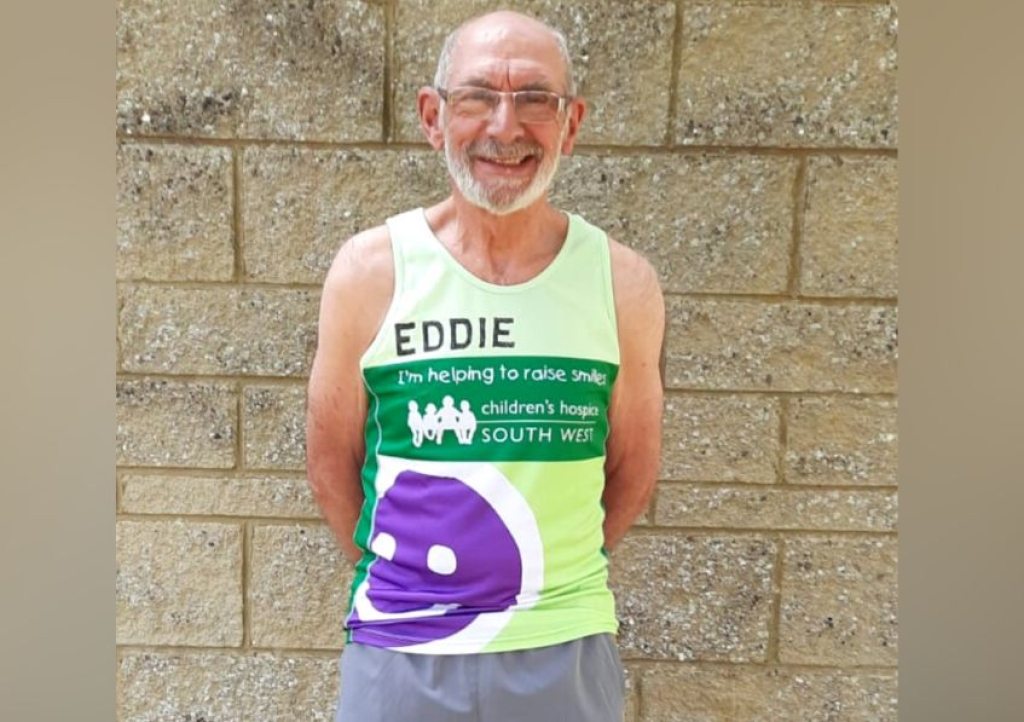 Eddie wearing Children's Hospice South West running vest