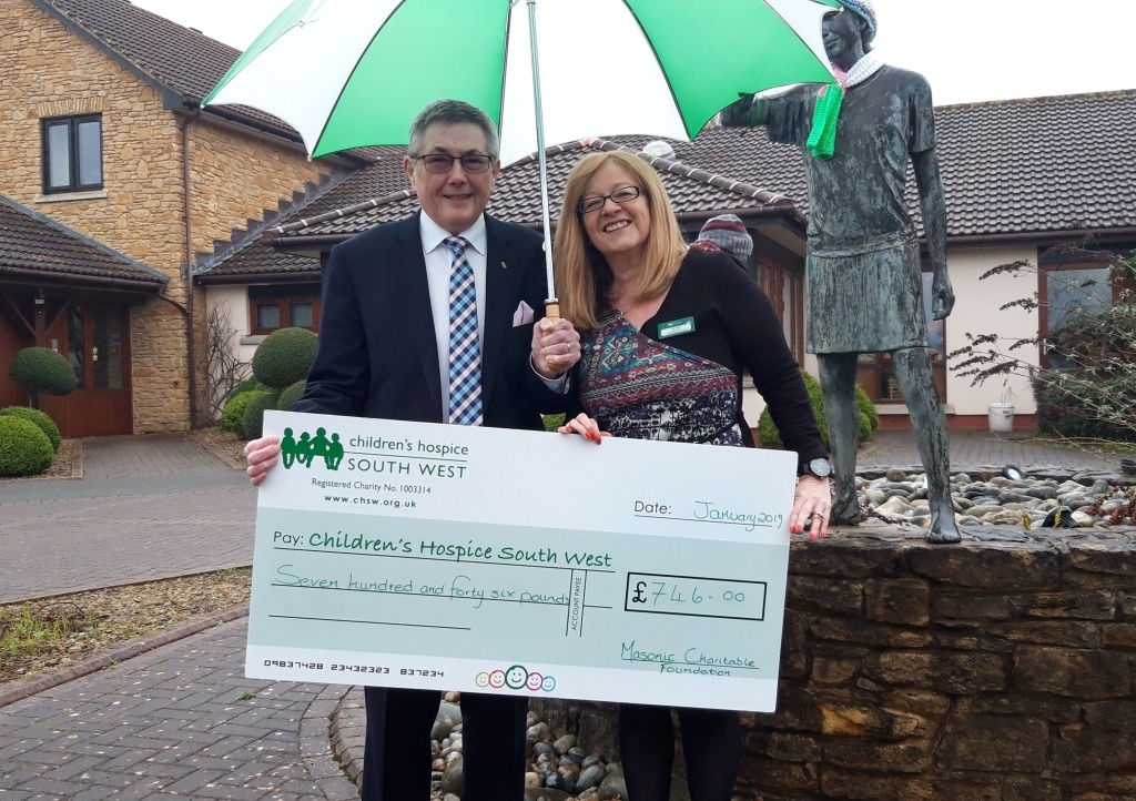 Charles Yelland Assistant Provincial Grand Master of the Devonshire Freemasons, presents a cheque