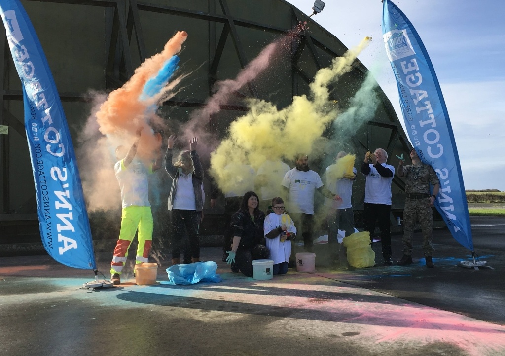 Paint station sponsors of the 2019 Newquay Rainbow Run have a practice at paint throwing before the big day