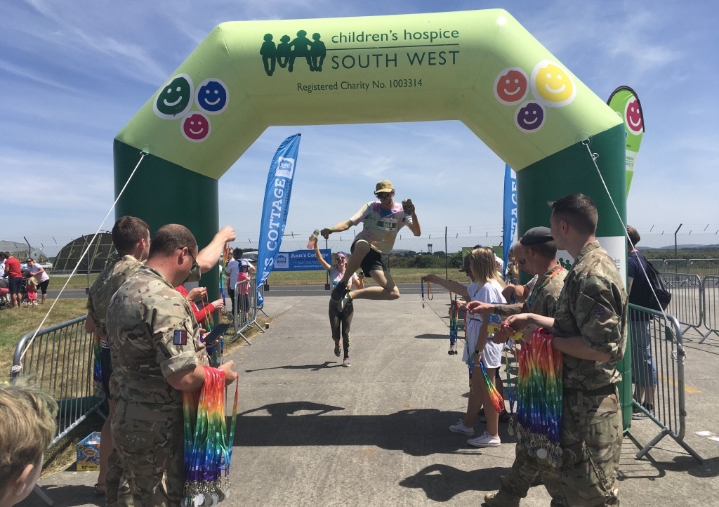 Jumping through Rainbow Run finish