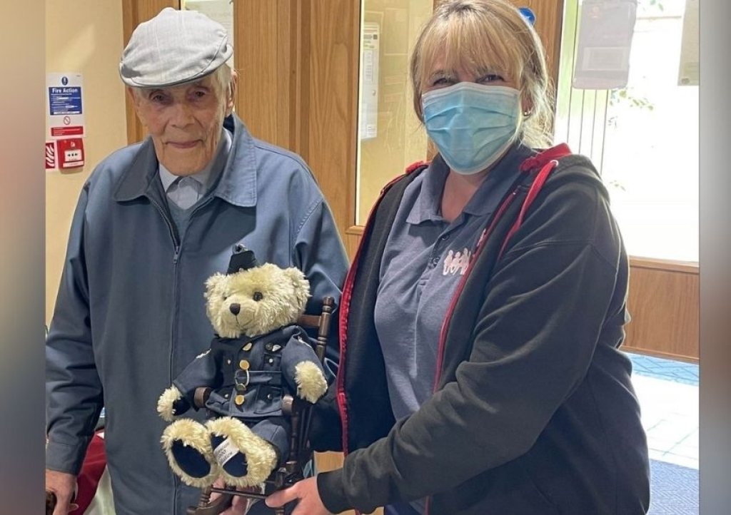 Jim Squires hands over his teddy bear to Michelle North, Senior Care Administrator at Little Bridge House