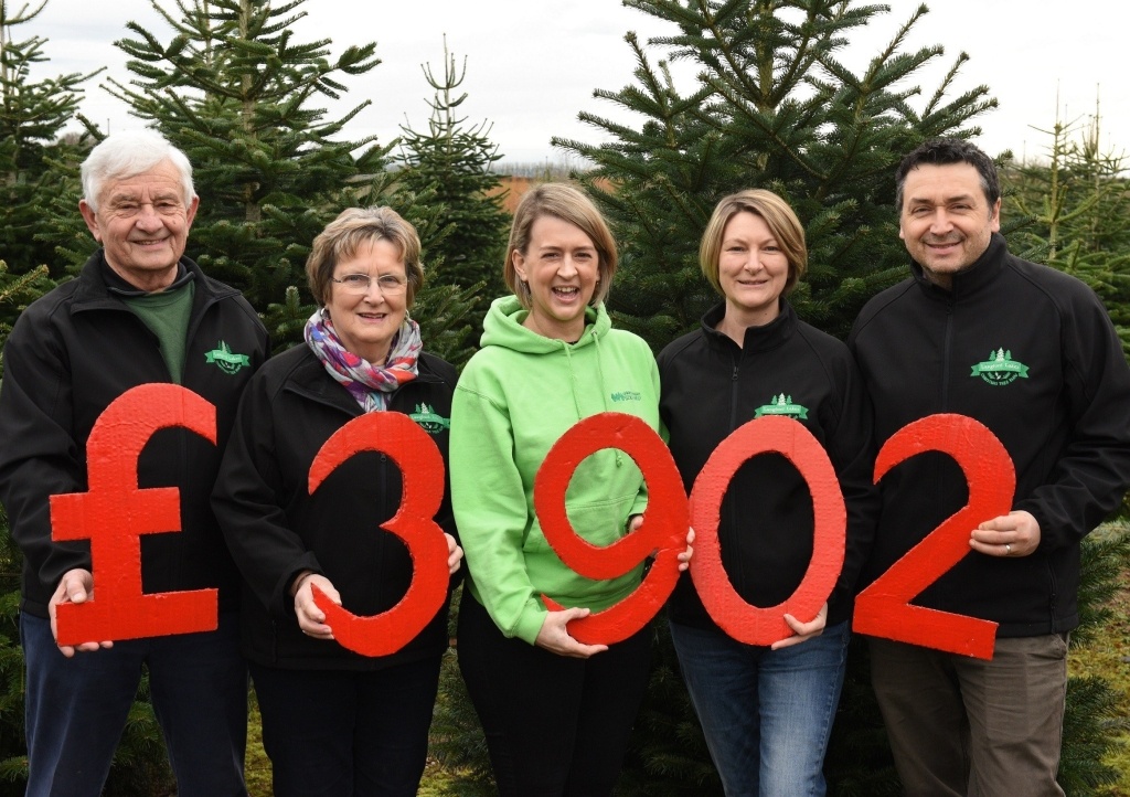 Laura Robertson, Community Fundraiser at CHSW (centre) with Reg, Ann, Clare and Nick Hendy from Langford Lake Christmas Tree Farm.