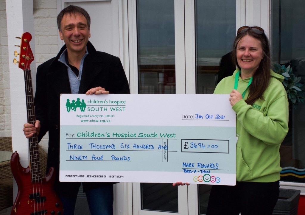 Mark Edwards presents his cheque to CHSW area fundraiser Ruth Morgan. Picture: Kevin Green