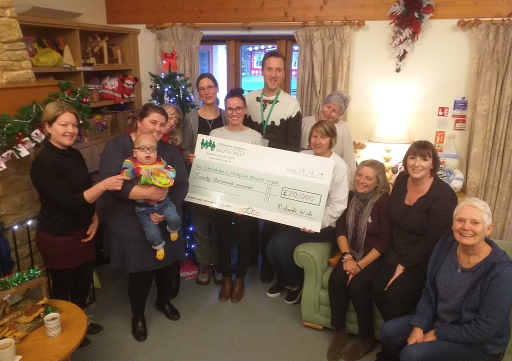 Rachel Cridge and Henry Dunn present the £20,000 cheque to the team at LBH