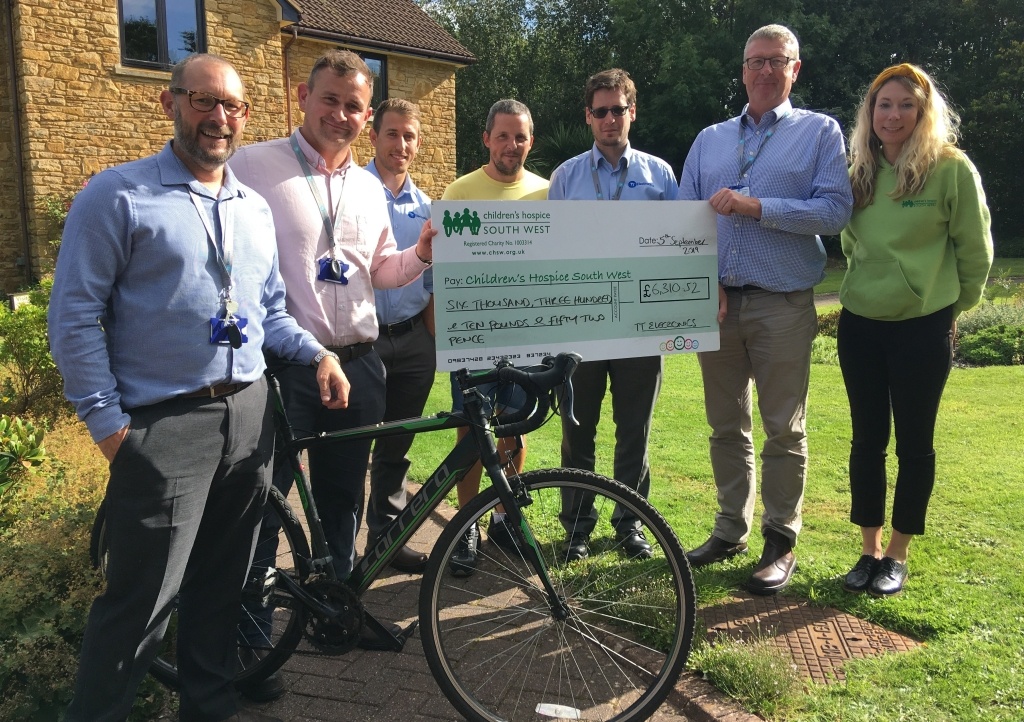 The TT Electronics (from left) Shane Rice, Matt Green, Ben Morris, Kieran Hodge, Mark Lobato and Mark Chatburn present their fundraising cheque to CHSW corporate partnerships fundraiser Mhairi Bass-Carruthers