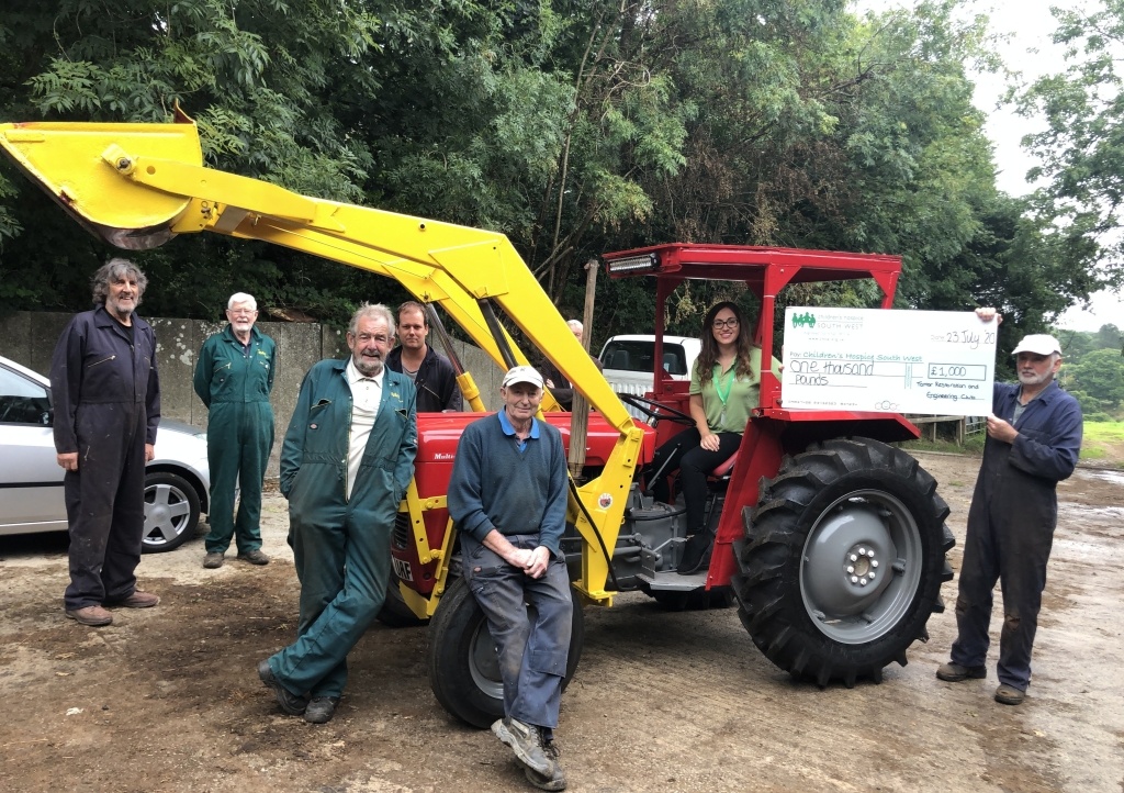 Members of Tamar Restoration and Engineering Club hand over their donation to Sherelle from CHSW
