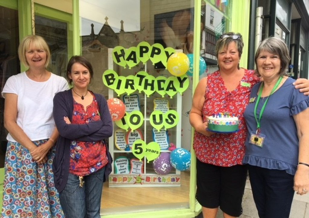 Totnes staff and volunteers celebrate the shop's 5th birthday