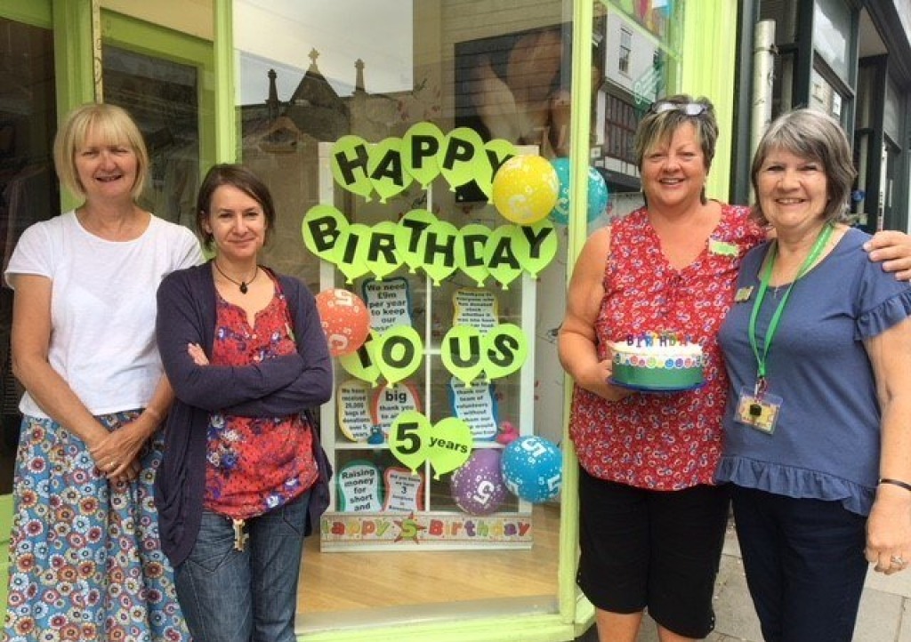 Totnes staff and volunteers celebrate the shop's 5th birthday