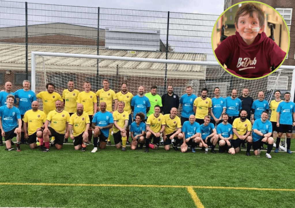 The charity match team with a photo of Oliver Brown