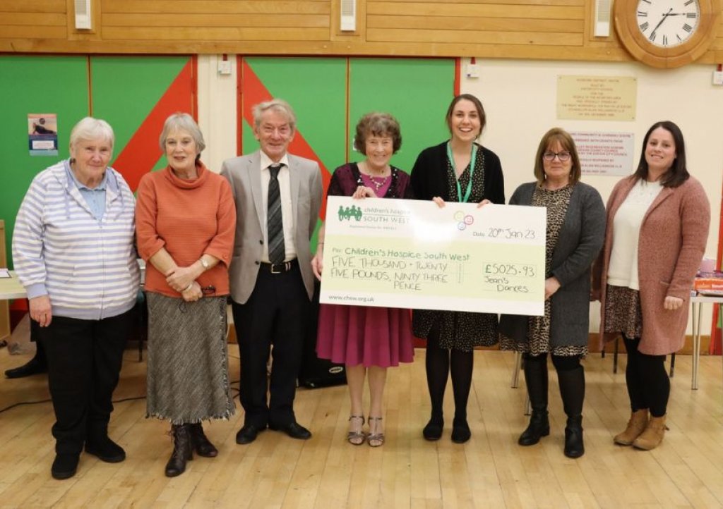 Jean, Mike and friends present the fundraising cheque to Children’s Hospice South West area fundraiser Mary Gray.