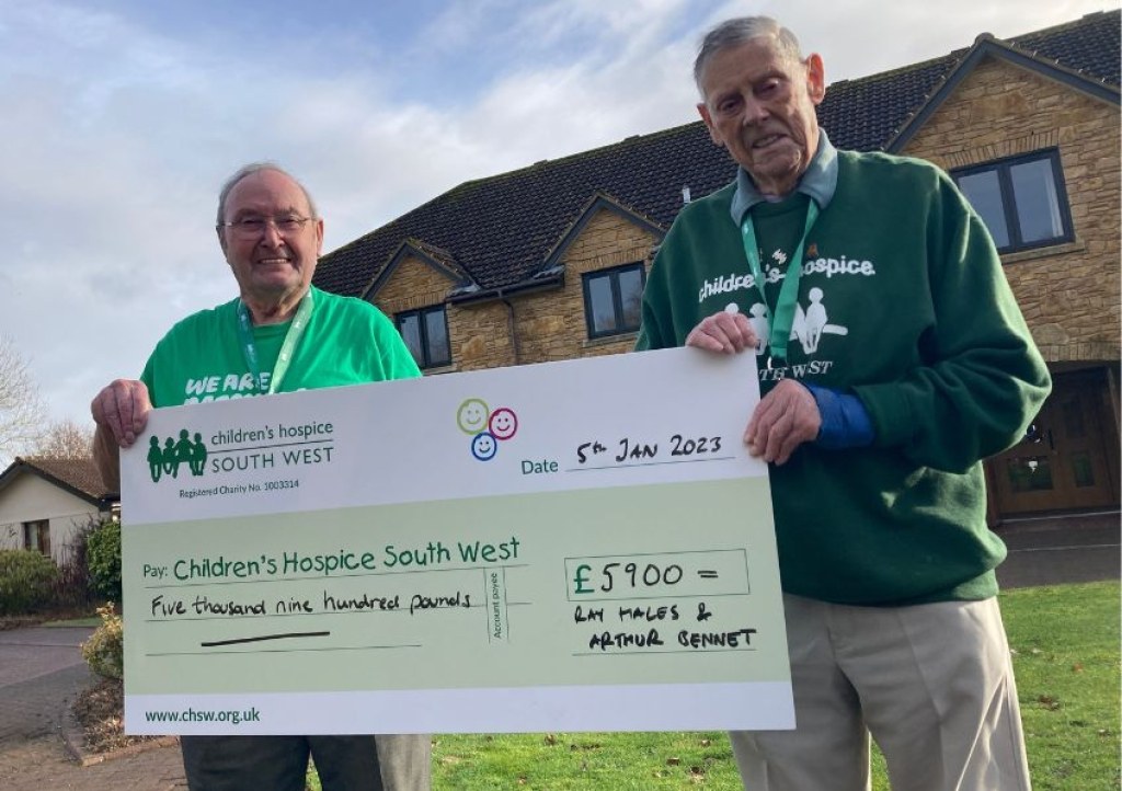 Friends Ray Hales and Arthur Bennett present their cheque at Little Bridge House