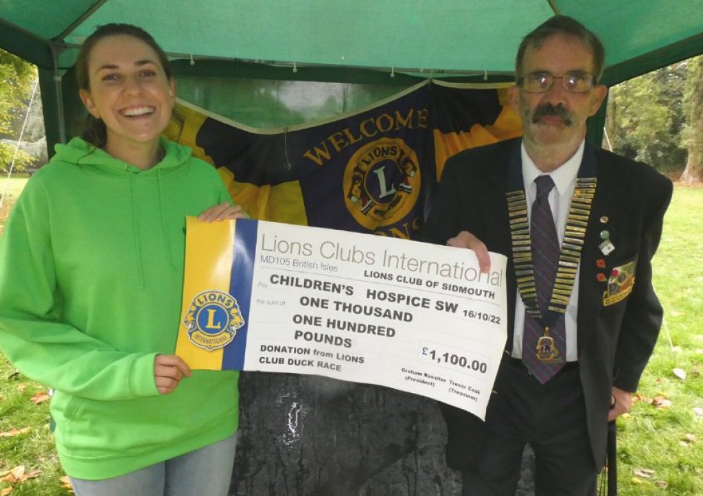 CHSW fundraiser Mary Gray receives the cheque from Sidmouth Lions club president Graham Rossiter