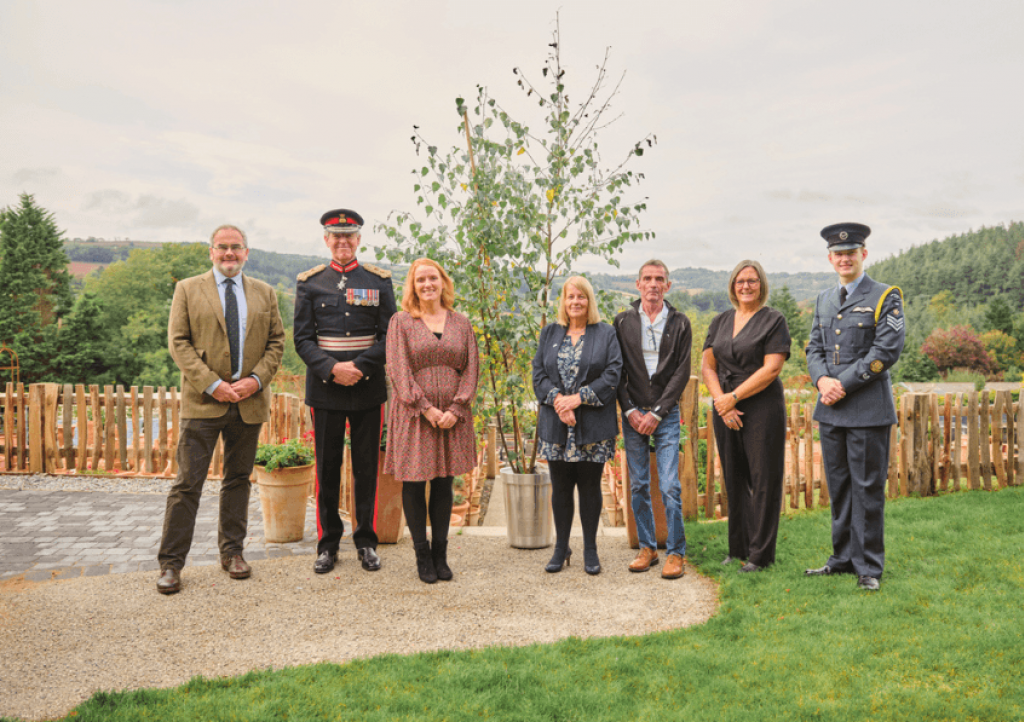Little Harbour’s Head of Fundraising Sarah Stott and volunteers receive the tree from the Lord Lieutenant of Cornwall, Colonel Edward Bolitho OBE, and Geraint Richards MVO, Head Forester at the Duchy of Cornwall. Pic: John Hersey 
