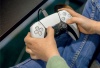 Hands holding a gaming controller