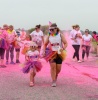 Mum and daughter covered in pink powder paint