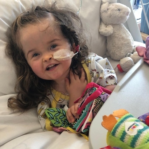 Baby girl in hospital smiling