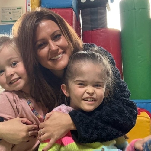 Mum and two daughters in the soft play